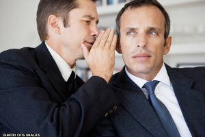 businessmen-whisping-secret-into-ear